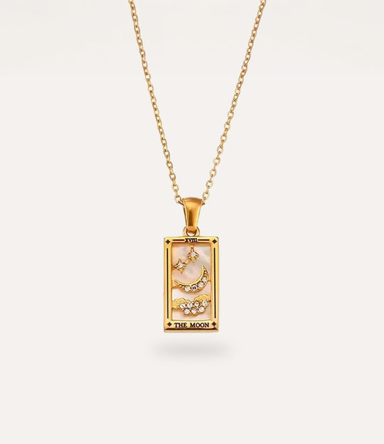 The moon - gold tarot card pendant necklace with link chain displayed on a neutral background.