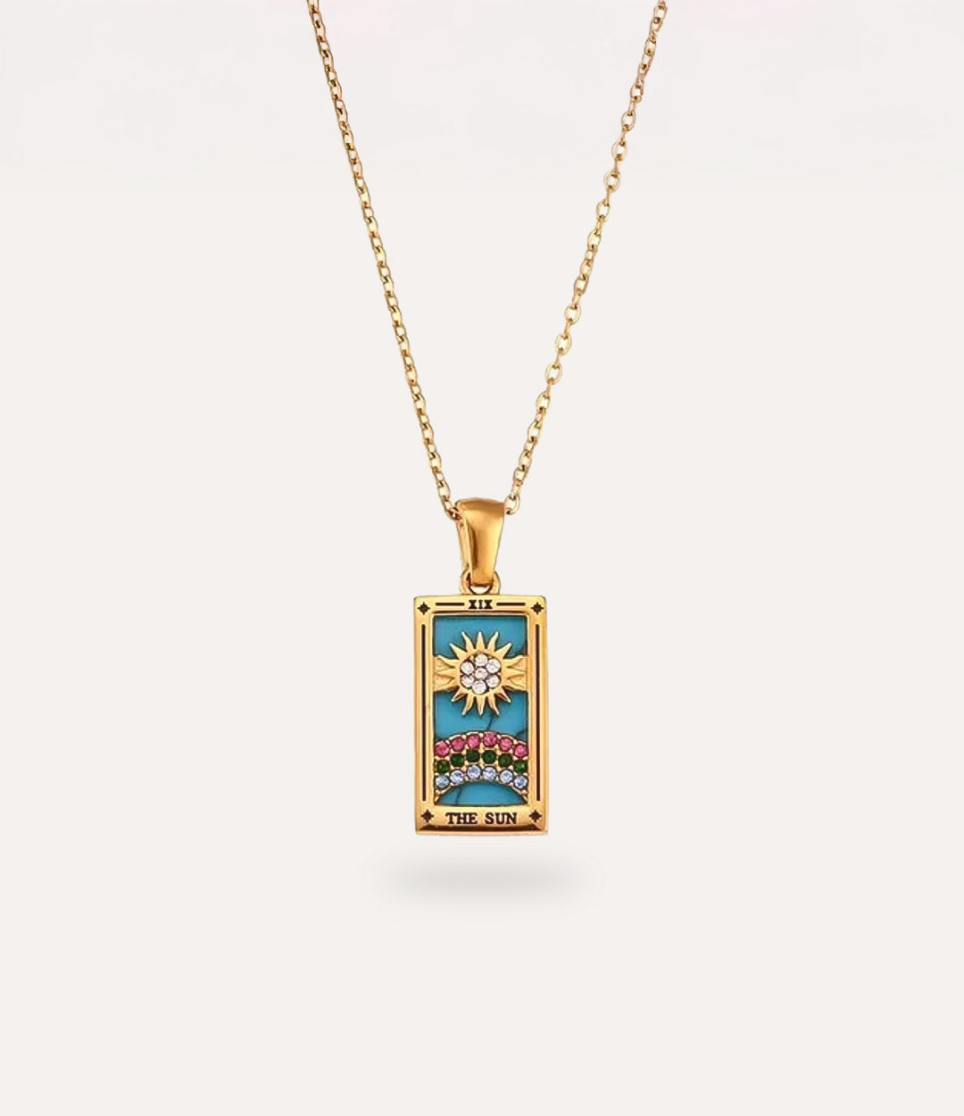 The sun - gold tarot card pendant necklace with link chain displayed on a neutral background.