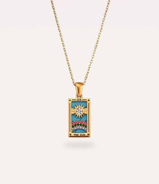 The sun - gold tarot card pendant necklace with link chain displayed on a neutral background.
