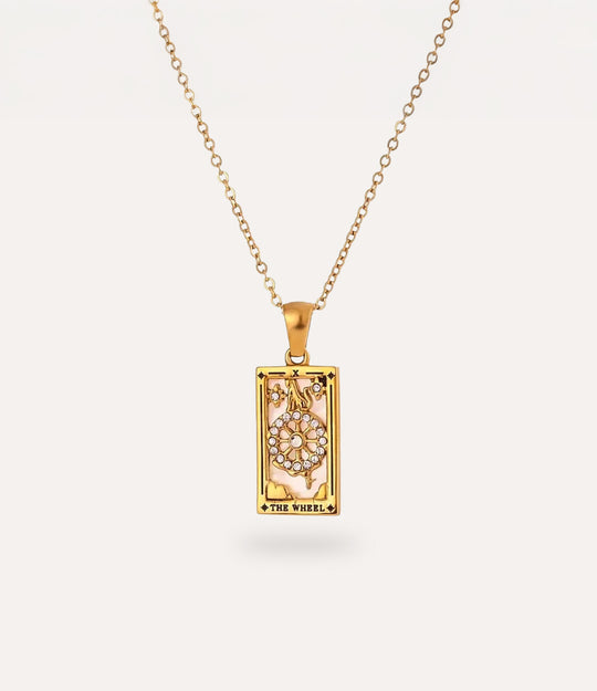 The wheel - gold tarot card pendant necklace with link chain displayed on a neutral background.