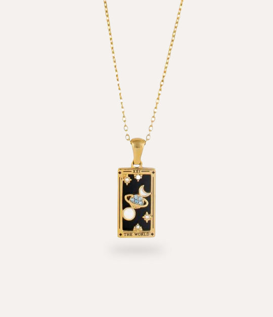 The world - gold tarot card pendant necklace with link chain displayed on a neutral background.