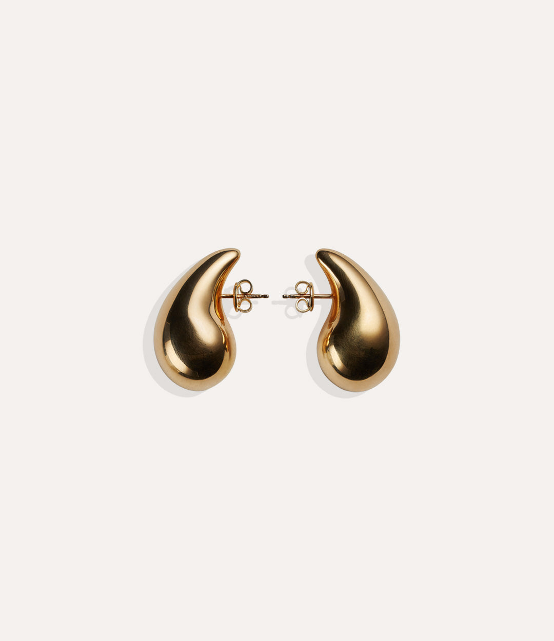 Product shot of the Tear Drop Stud in 14k gold plating displaying the smooth water drop silhouette and high shine finish on a white background.