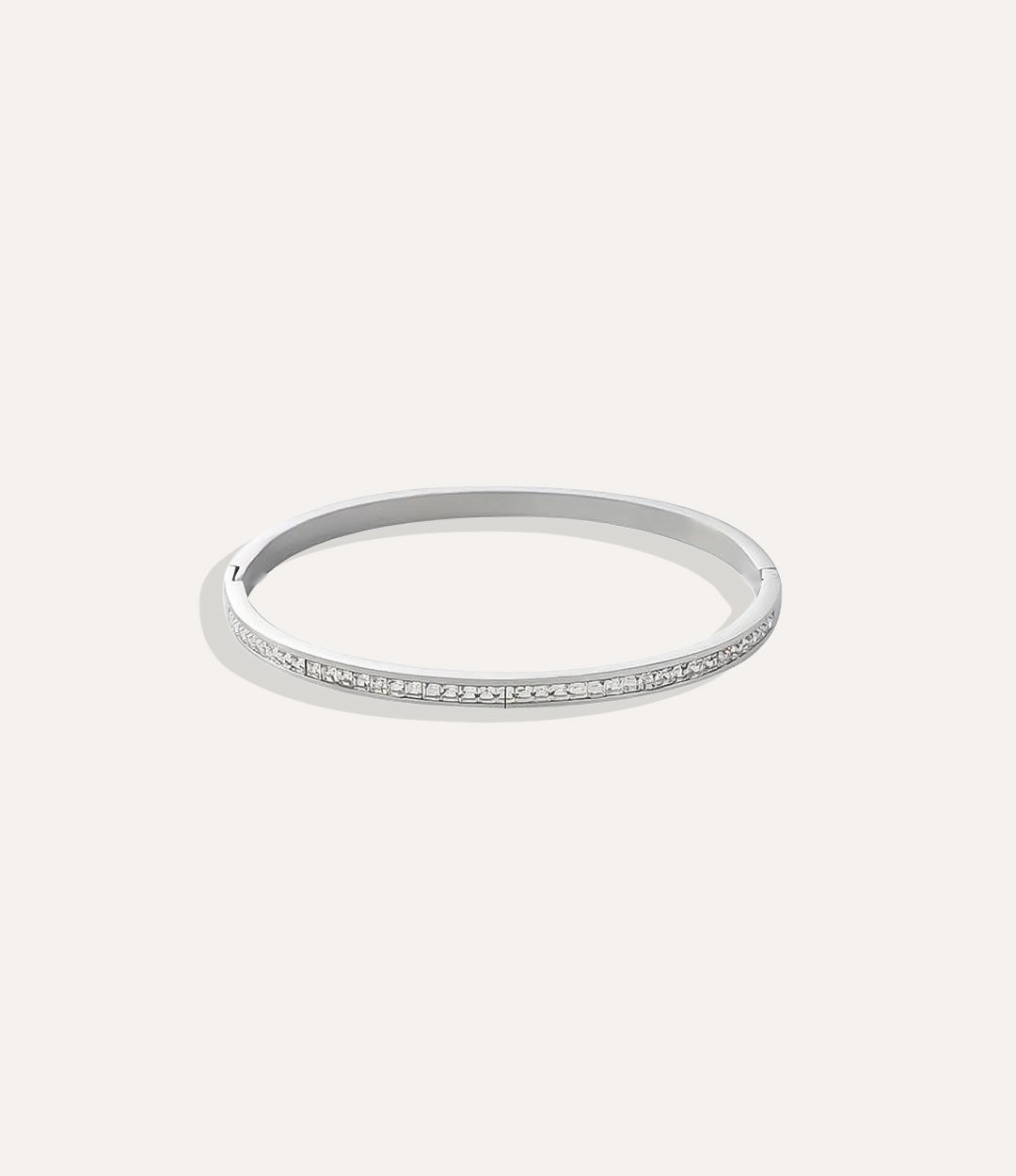The Duchess Bangle in stainless steel displayed on a neutral background.”