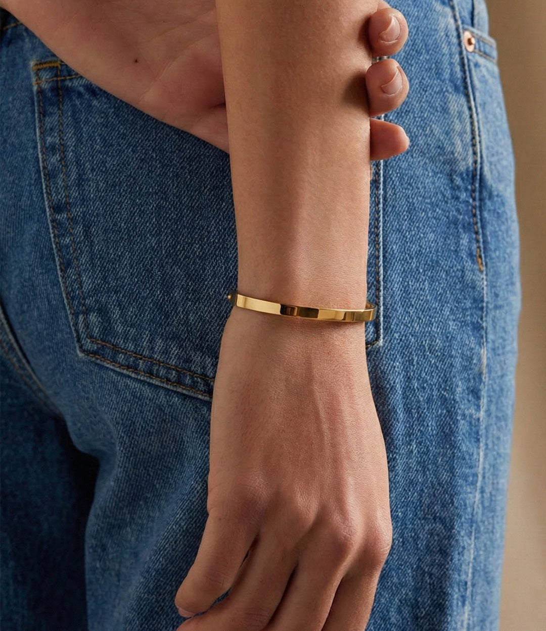 Model wearing The Essential Bangle for an elevated look.