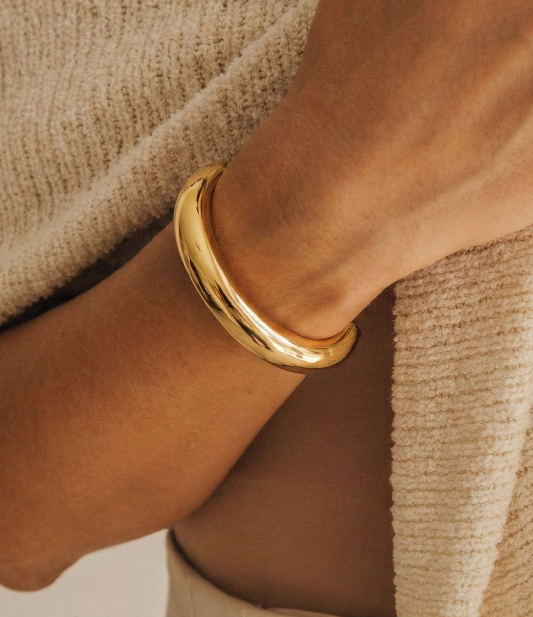 Model wearing The Essential Half Cuff in solo styling for a modern, minimal look.