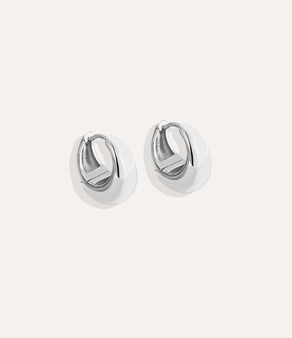 Product shot of The Essential Hoops in silver colour showing the cool metallic tone and puffy bottom heavy design on a white background.