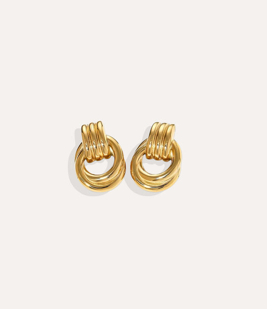 Product shot of The Knot Earring in 18k gold plating displaying the warm metallic tone and intricate knot detail on a white background.