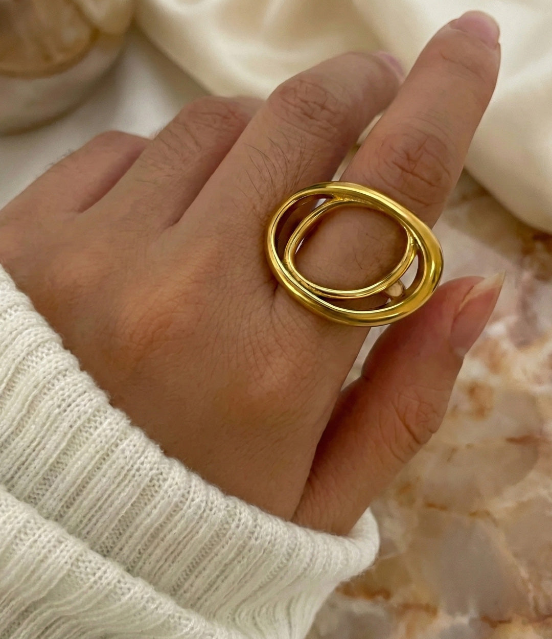 The O Ring in 18k gold plated finish, featuring a flat, open circle design made of durable stainless steel, isolated on a white background.