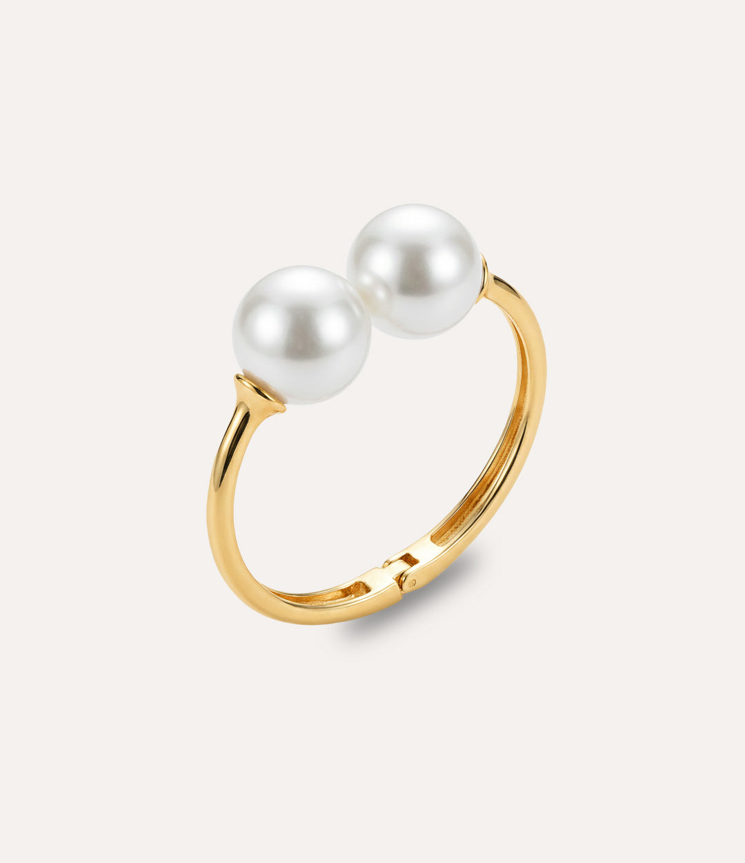 Gold pearl bangle featuring two symmetric pearls in a classic balanced design.