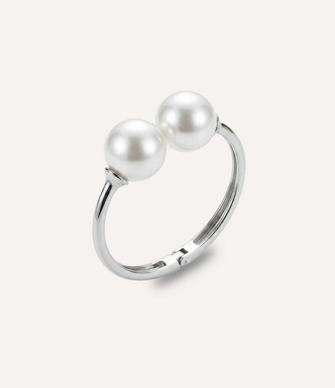 Silver pearl bangle featuring two symmetric pearls in a classic balanced design.