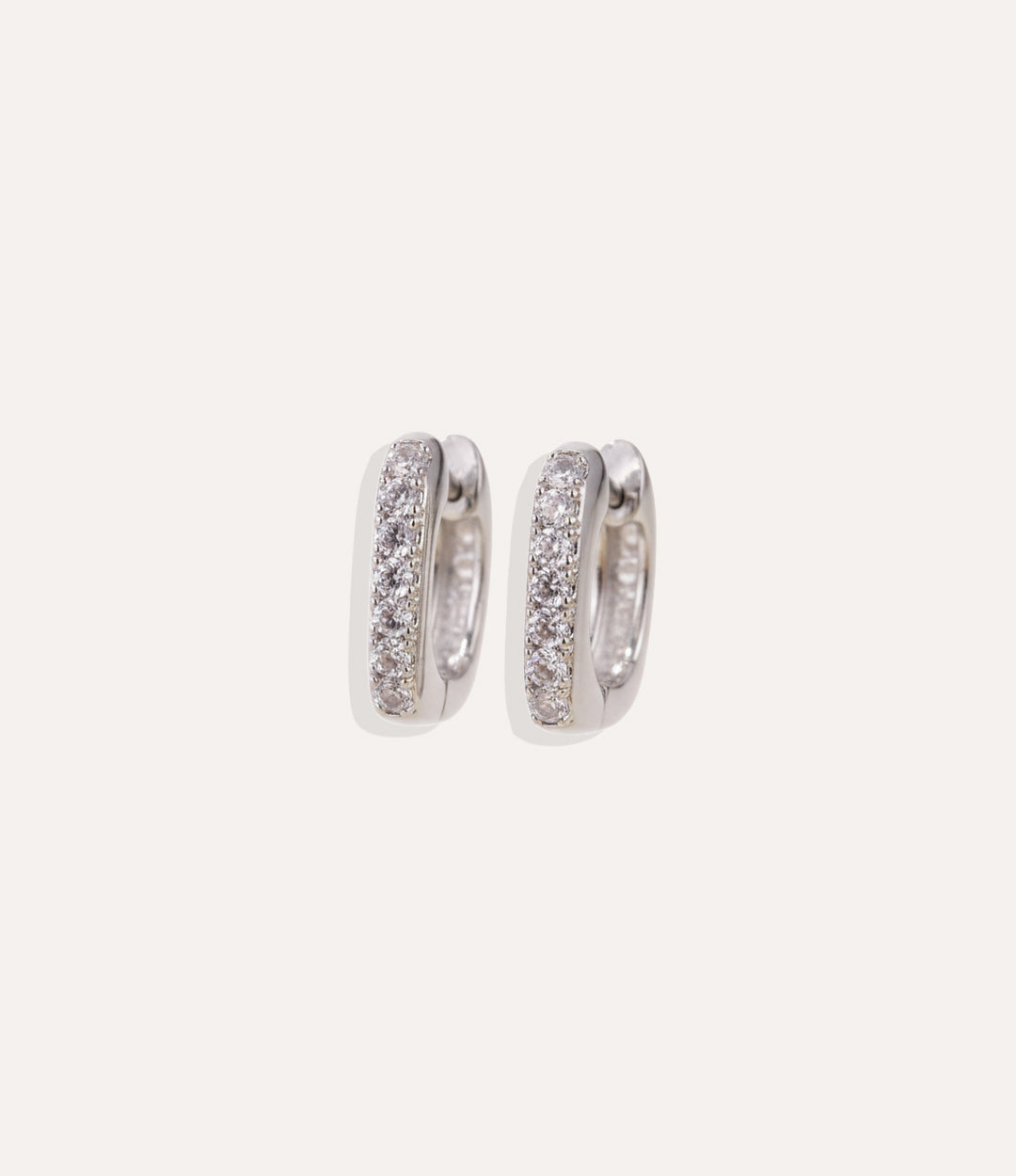 Close up of the rectangle silver hoops from The Silver Hoop Collection with diamond accents, showing the clean and polished finish.