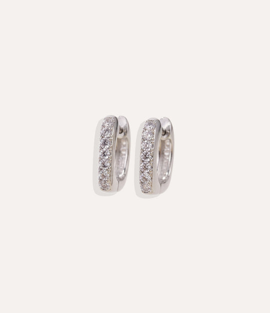 Close up of the rectangle silver hoops from The Silver Hoop Collection with diamond accents, showing the clean and polished finish.