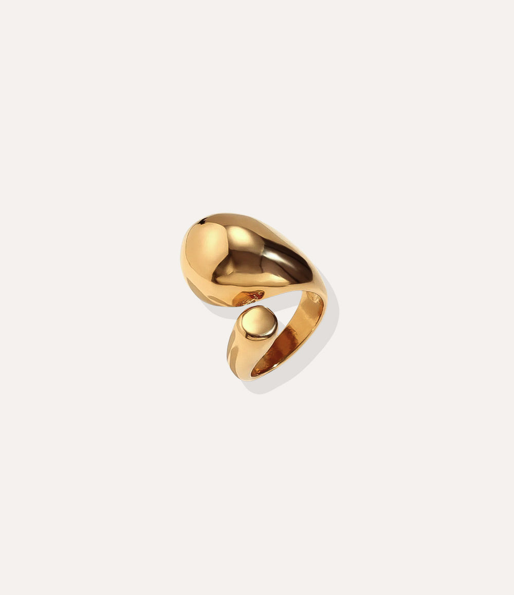The Stella Ring in 18k gold plated finish, featuring a celestial shooting star motif made of waterproof stainless steel, isolated on white.