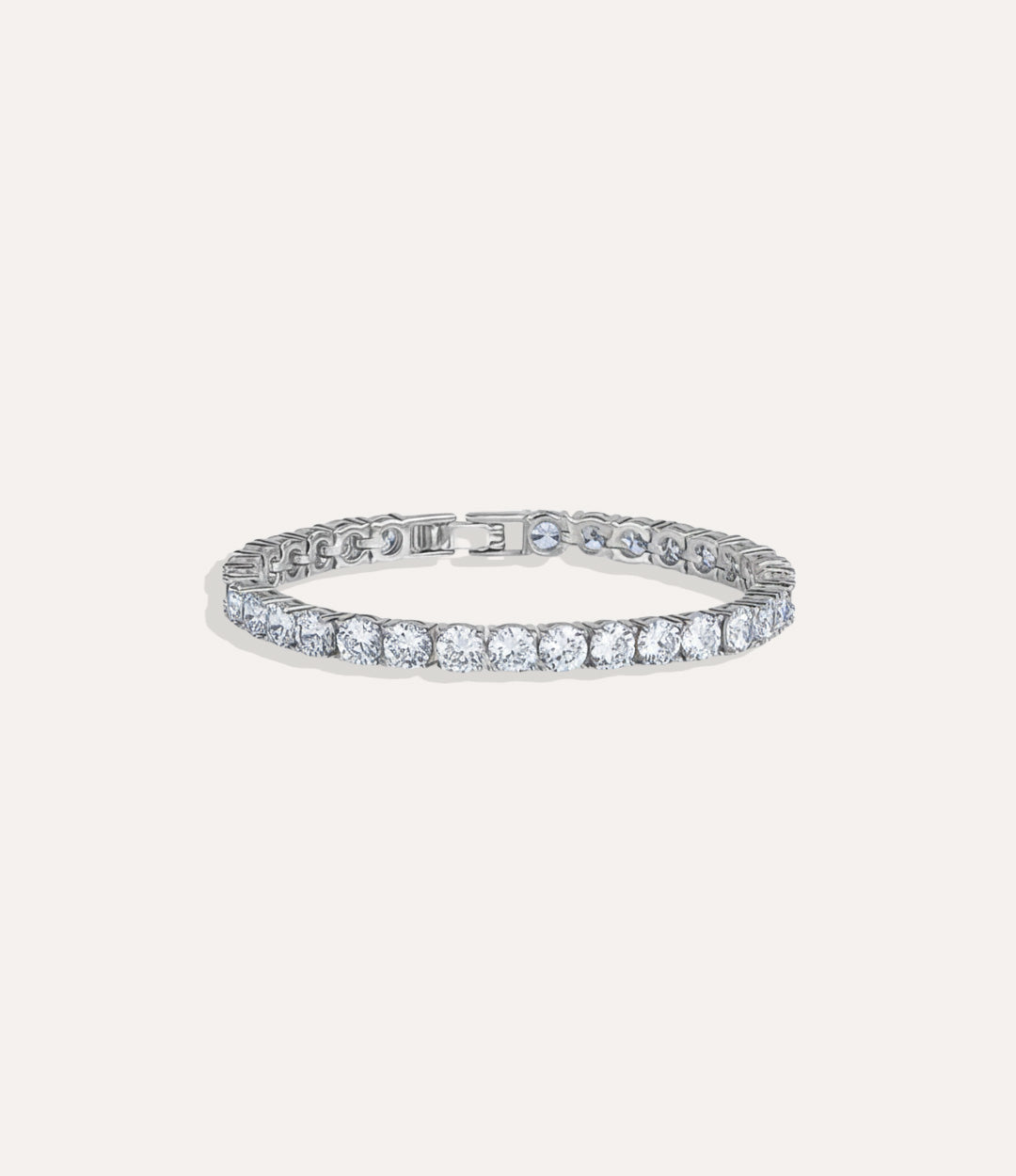 Tennis Bracelet Collection featuring silver-plated bracelets with round diamonds in 1k, 2k, and 3k sizes displayed on a neutral background.