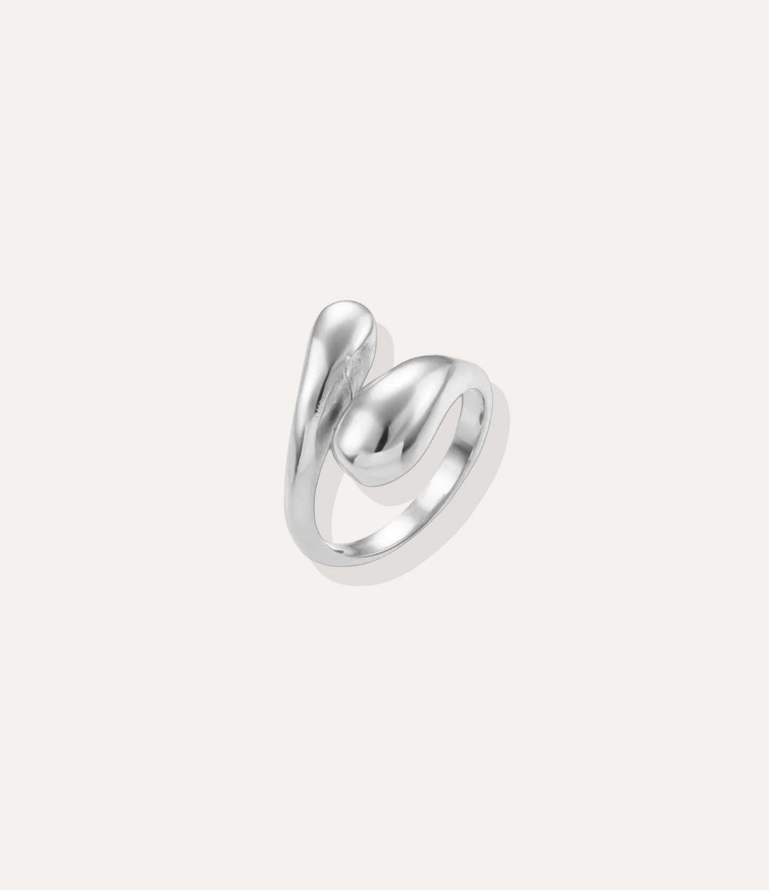 Sterling Silver Twist Ring, highlighting the cool polished finish, adjustable open shape, and modern edgy aesthetic.