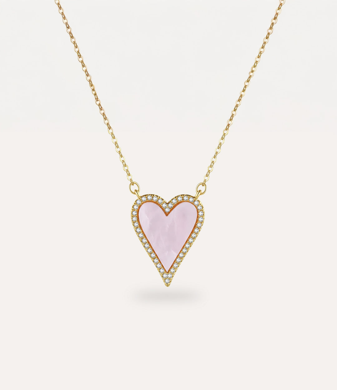 Heart-shaped pink pendant necklace on a white background