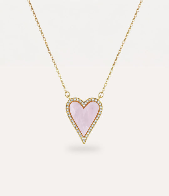 Heart-shaped pink pendant necklace on a white background