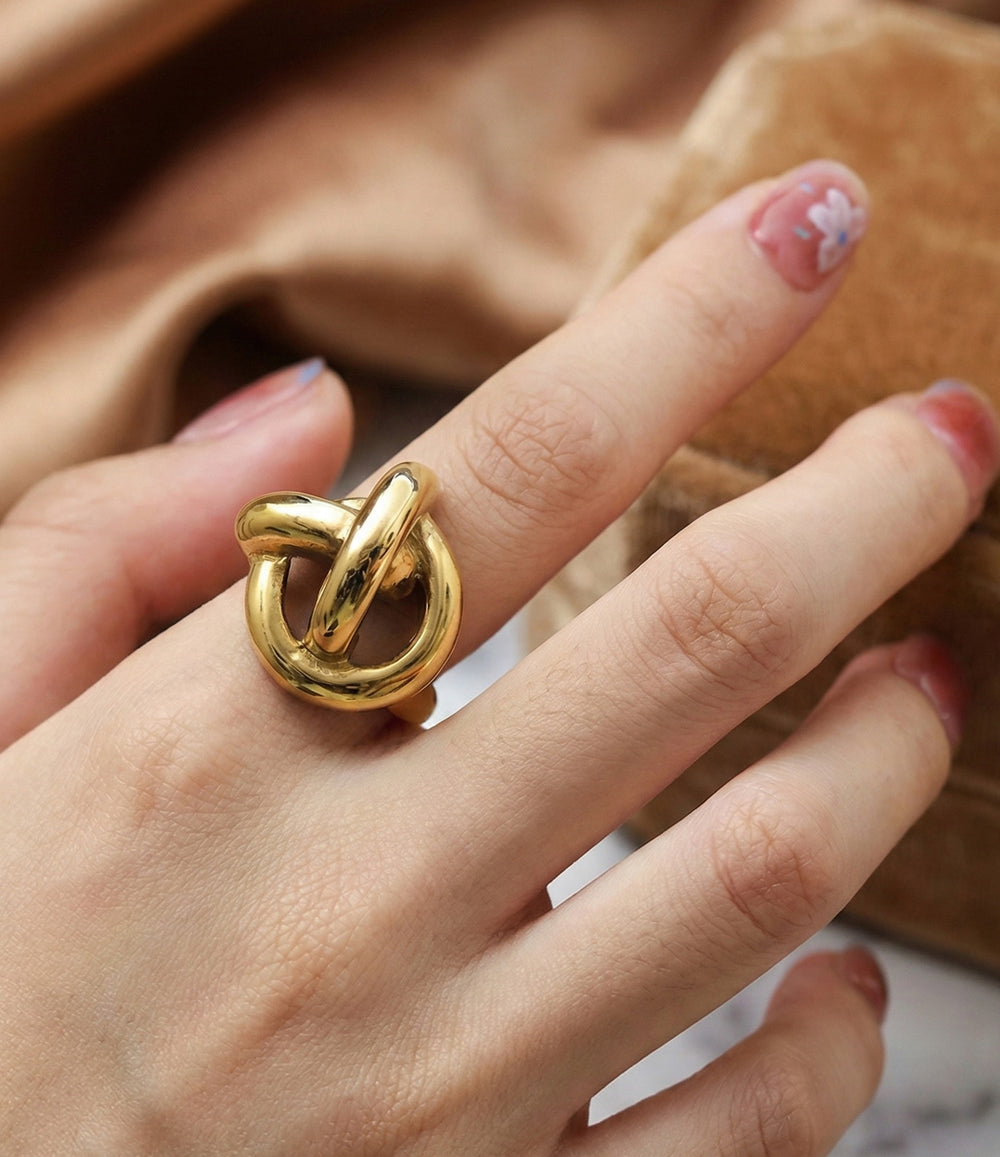 Woman's hand modeling the Twisted Statement Ring alone on the index finger, showcasing the chunky vintage-inspired silhouette and bold presence.