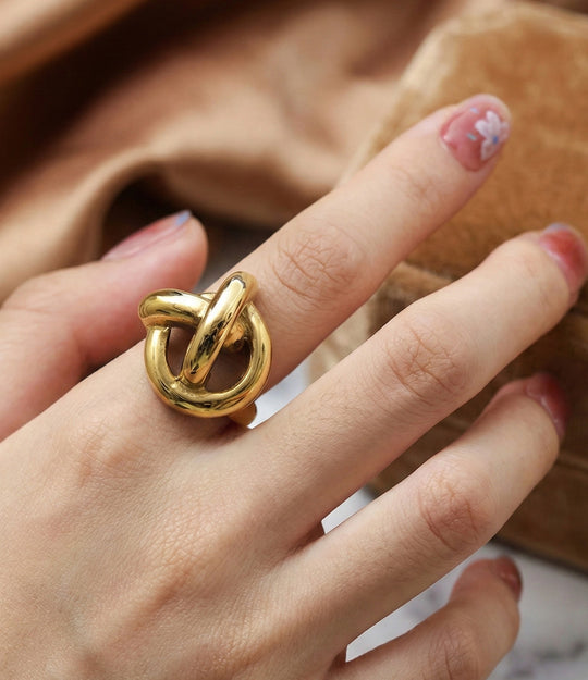 Woman's hand modeling the Twisted Statement Ring alone on the index finger, showcasing the chunky vintage-inspired silhouette and bold presence.