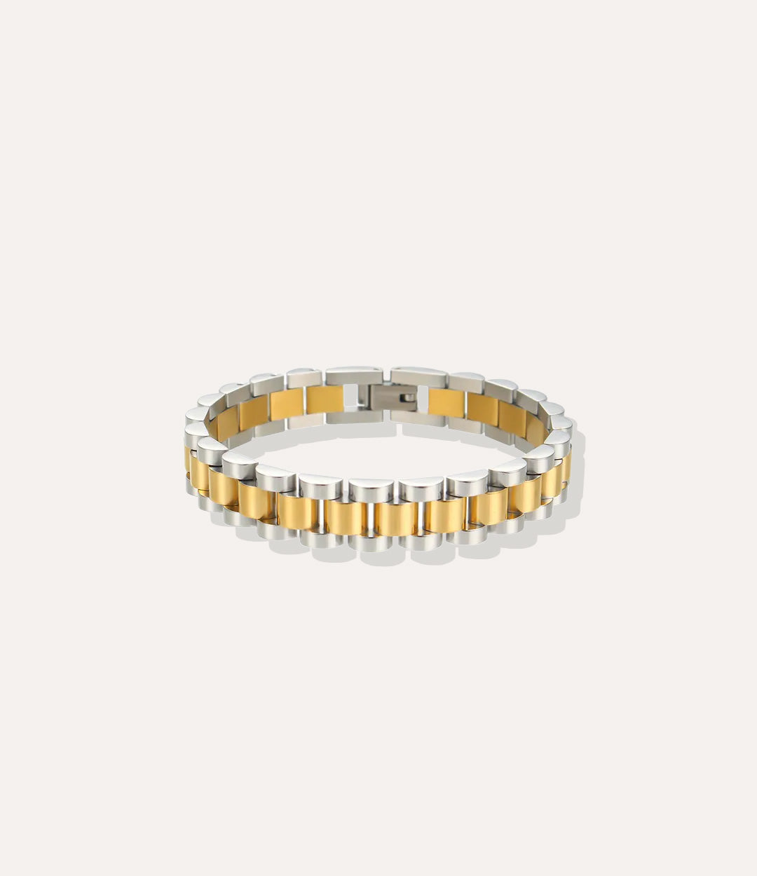 Two-tone silver and gold bracelet on a white background
