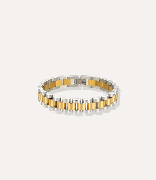 Two-tone silver and gold bracelet on a white background